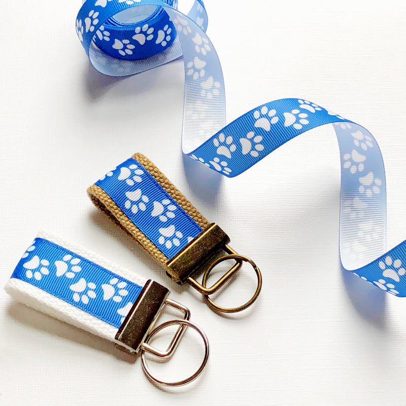 Paw prints on Carolina blue key fob, dog owner gift, key chain, Key fob, new driver, keychain, wristlet, dog parent gift, rescue pets - Bloom And Anchor