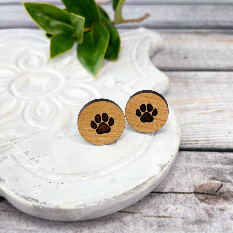 Engraved wooden cufflinks with a paw print